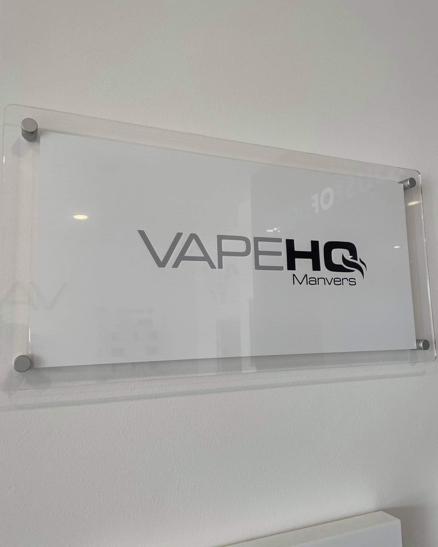 Clear acrylic sign with business name